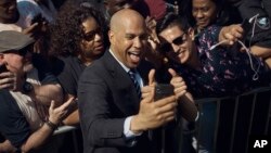 Cory Booker takes a selfie with supporters during a hometown kickoff of his presidential campaign tour at Military Park in downtown Newark, N.J., April 13, 2019.