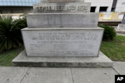 FILE - The Liberty Place monument in downtown New Orleans, Sept. 2, 2015. In December, the New Orleans City Council voted to remove the obelisk commemorating the Battle of Liberty Place, as well as other Confederate-related statutes.