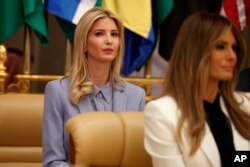 Ivanka Trump, left, and Melania Trump wait for the start of a speech by President Donald Trump to the Arab Islamic American Summit, at the King Abdulaziz Conference Center, May 21, 2017, in Riyadh, Saudi Arabia. In 2015, Trump lashed out at Michelle Obama for not wearing a headscarf on her visit to Saudi Arabia.