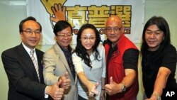 Members of League of Social Democrats pose during a post by-election press conference in Hong Kong, 17 May 2010