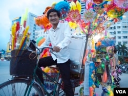 Pham Minh Dap, 24, sells balloons and toys to fund a free language school in Hanoi, Vietnam.
