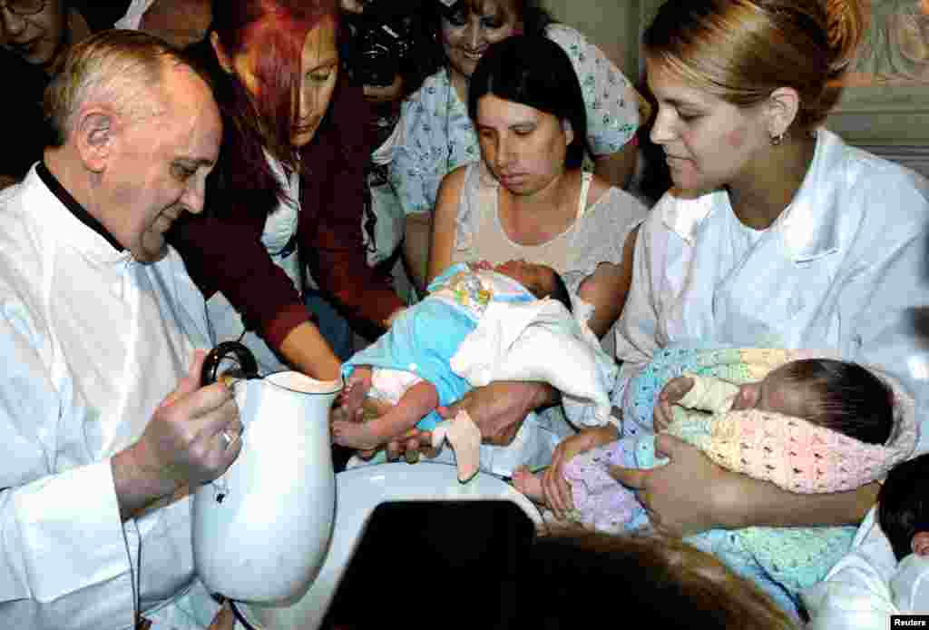 Then Argentine Cardinal Jorge Bergoglio washes the feet of two newly born children on Holy Thursday at the Buenos Aires&#39; Sarda maternity hospital, March 24, 2005.