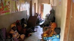 Women wait for treatment at a clinic in Kenya.