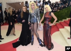 Allegra Versace, from left, Lady Gaga and Donatella Versace arrive at The Metropolitan Museum of Art Costume Institute Benefit Gala, celebrating the opening of "Manus x Machina: Fashion in an Age of Technology" on May 2, 2016, in New York.