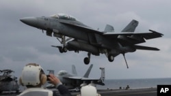 A U.S. Navy's F/A-18 Super Hornet fighter approaches the deck of the Nimitz-class aircraft carrier USS Carl Vinson during the annual joint military exercise between South Korea and the United States, March 14, 2017.