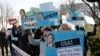 FILE - Protesters holding portraits of U.S. Deputy Secretary of State Tony Blinken denounce U.S. policy against North Korea at the Foreign Ministry in Seoul, South Korea, Feb. 9, 2015. 