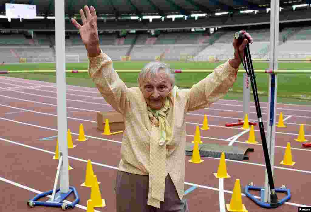 A participant reacts after crossing the finishing line of the steeple chase event during the "Olympics for Seniors" at King Baudouin stadium in Brussels, Belgium, June 13, 2017.