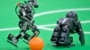 Robots play soccer in the Kids League at the RoboCup German Open 2014 in Magdeburg, Germany, April 3, 2014. (Reuters)