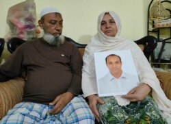 Abdul Jalil Khan, 74, and his wife, with the photo of their son, Mahabub Hasan Sujan, who became a victim of enforced disappearance in Bangladesh in 2013. Eyewitnesses reported that the opposition student leader Sujan and one of his party colleagues were abducted by members from a security agency. (Photo, Abul Hassan)