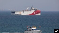 Turkey's research vessel Oruc Reis is anchored off the coast of Antalya on the Mediterranean Sea in Turkey. In a tweet Monday, Nov. 30, 2020, Turkey’s energy ministry said the Oruc Reis had returned to port in Antalya after completing two-dimensional seismic research in the Demre