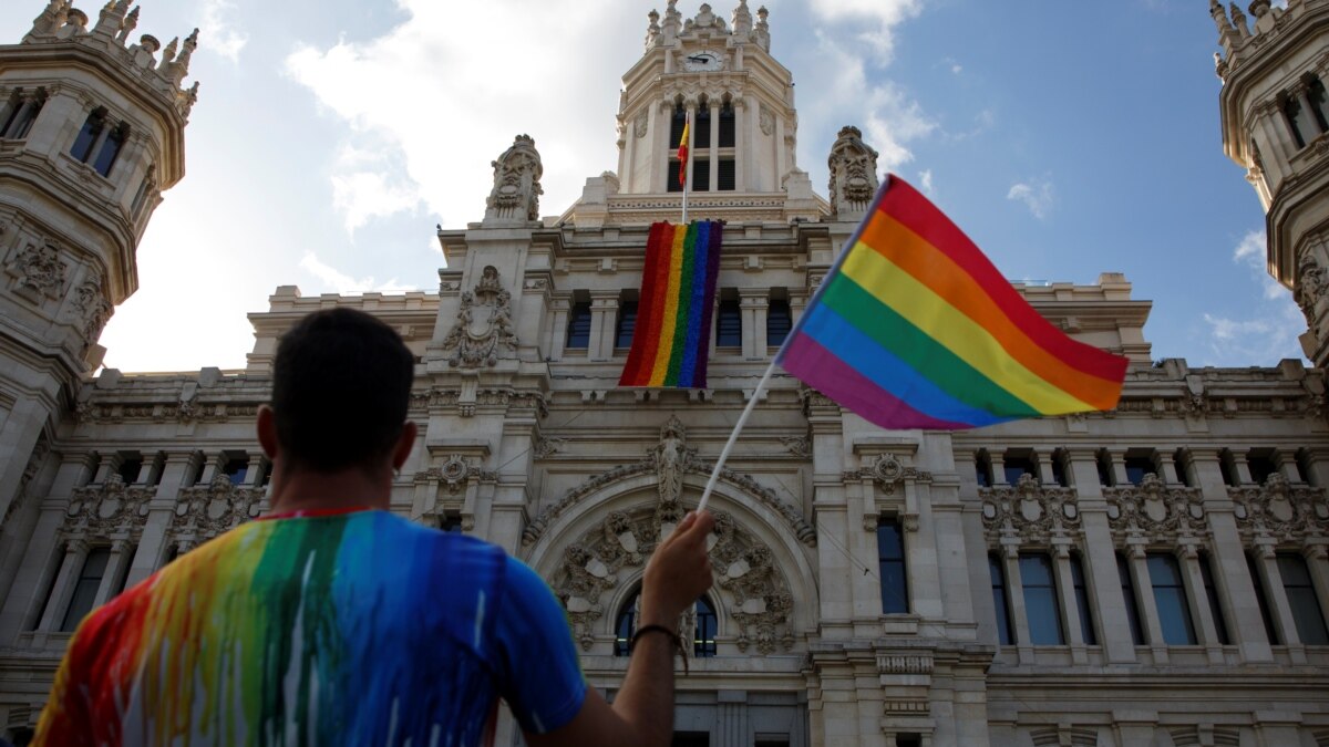 Rainbow flags fly from official buildings in Madrid and Valencia, Spain