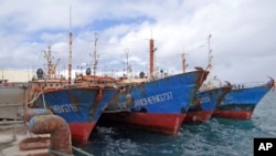 FILE - Luen Thai Fishing Venture boats are docked at the Majuro port in the Marshall Islands on Feb. 1, 2018. Luen Thai is one of the companies that was supplying fish that entered the supply chain of Sea To Table. 