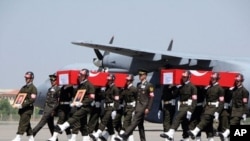 Turkish soldiers carrying the coffins of soldiers who were killed in an attack by members of the Kurdistan Workers' Party (PKK) during funerals in Van, August 18, 2011.