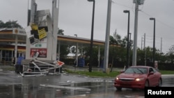 A gas station sign lays destroyed after Hurricane Irma blew though Fort Lauderdale, Florida, Sept.10, 2017. 