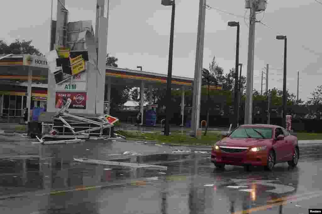 A gas station sign lays destroyed after Hurricane Irma blew though Fort Lauderdale, Florida, Sept. 10, 2017.