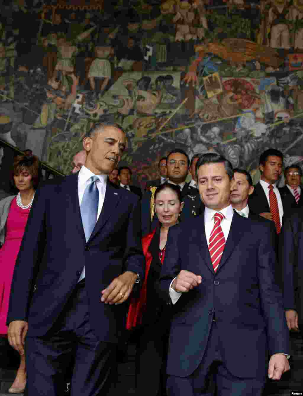U.S. President Barack Obama and his Mexican counterpart Enrique Pena Nieto walk down a staircase at the National Palace in Mexico City, May 2, 2013.
