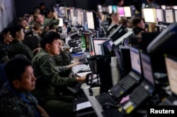 FILE - Members from U.S. and South Korean militaries man the Hardened Theater Air Control Center during the first day of Ulchi Freedom Guardian at Osan Air Base, South Korea, Aug. 17, 2015