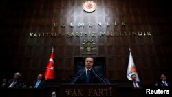 Turkey's Prime Minister Tayyip Erdogan addresses members of parliament during a meeting at the Turkish parliament in Ankara, June 17, 2014.