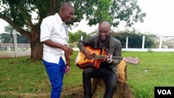 Emmanuel Bilashi (L) and Lindfort Ci are seen in Bamenda, Cameroon, Dec. 2, 2018. (M. Kindzeka/VOA)