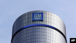 FILE - The General Motors headquarters building is seen in Detroit, Michigan, May 5, 2011. On Tuesday, President-elect Donald Trump criticized the largest U.S. automaker for sending its Mexican-made Chevrolet Cruze compact models back to U.S. car dealers 