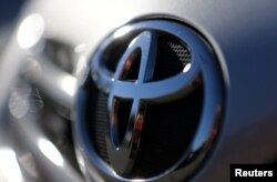 The Toyota logo is seen on a car in Sao Paulo, Brazil, June 2, 2017. Toyota has said it will make automatic emergency braking standard on nearly all its U.S. models by the end of 2017.