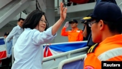 Taiwan President Tsai Ing-wen waves as she boards the Coast Guard's 3,000-ton class Yilan patrol vessel before Hai-an No. 10 maritime exercises, Taipei Port, New Taipei City, Taiwan, May 4, 2019. The U.S. House showed its support for Taiwan, passing to measures Tuesday.