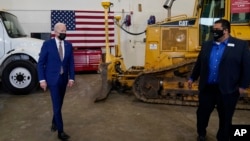 President Joe Biden tours the Dakota County Technical College in Rosemount, Minn., Nov. 30, 2021.