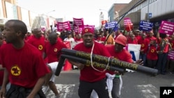 Striking workers belonging to unions under the Congress of South African Trade Unions march through Durban, July 12, 2011