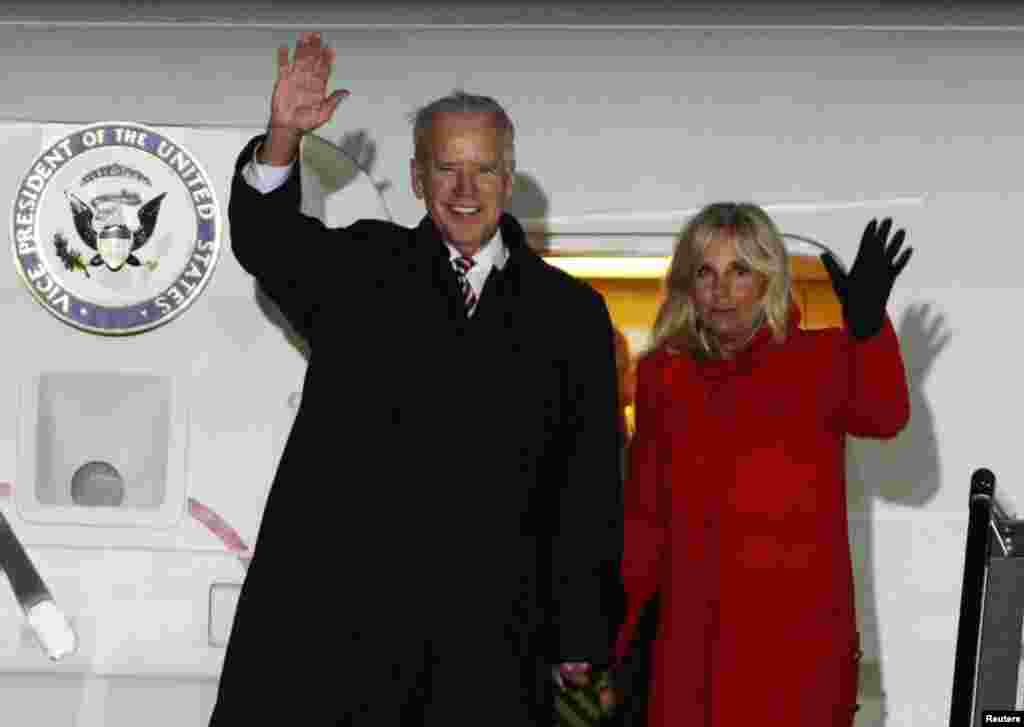 U.S. Vice President Joe Biden and his wife Jill wave upon their arrival at Boryspil International airport outside Kyiv, Nov. 20, 2014.