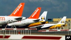 FILE - EasyJet planes are seen standing on the tarmac of Britain's Luton Airport.