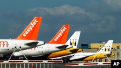 FILE - EasyJet planes are seen standing on the tarmac of Britain's Luton Airport.