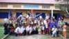 Oun Kosorl posed in a group photo in front of Mother Home Cambodia, a school he founded that provides free education to rural Cambodian students. (Courtesy of Oun Kosorl) 