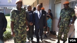 Former Malawi President Bakili Muluzi, center, is pictured outside the High Court in Blantyre. (L. Masina/VOA)