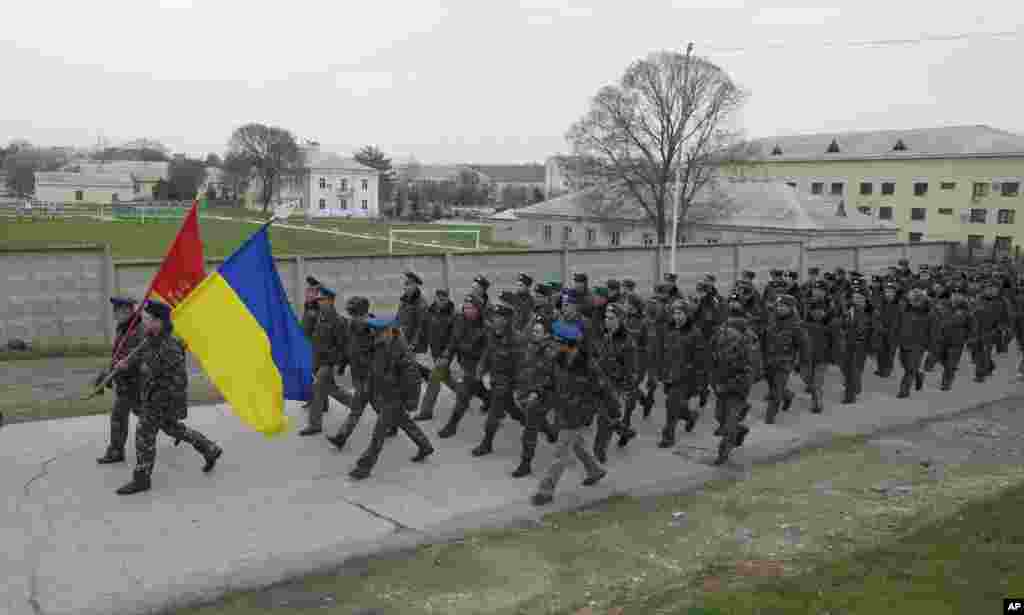 Ukrainian officers march at the Belbek air base, outside Sevastopol, Ukraine, March 4, 2014.