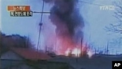 In this image take from TV footage, smoke rises from South Korea's Yeonpyeong island near the border against North Korea, 23 Nov 2010