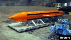 FILE - A Massive Ordnance Air Blast (MOAB) weapon is prepared for testing at the Eglin Air Force Armament Center on March 11, 2003.