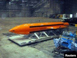 A Massive Ordnance Air Blast (MOAB) weapon is prepared for testing at the Eglin Air Force Armament Center on March 11, 2003.