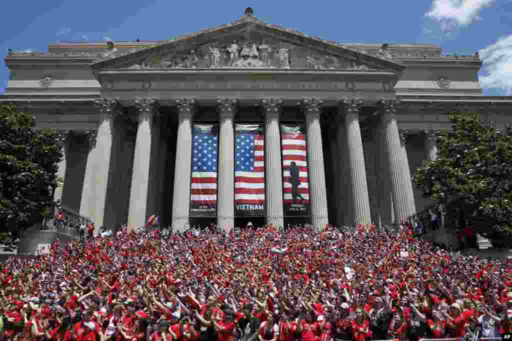 The crowd fills the steps of the National Archives as the Washington Capitals pass by during a Stanley Cup victory parade in Washington.