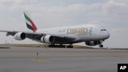 An Emirates Airbus A380 aircraft touches down at Chicago O'Hare International Airport (ORD) on Tuesday, July 19, 2016. (Jean-Marc Giboux/AP Images for Emirates Airline)