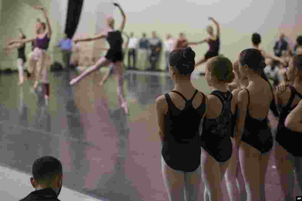 Young ballerinas watch company dancers rehearse &quot;The Nutcracker&quot; at the Cincinnati Ballet rehearsal studios in Cincinnati, Ohio, Dec. 3, 2015. &quot;The Nutcracker,&quot; widely popular with ballet companies in North America, has survived over 120 years and is mostly performed during the holiday season.