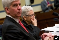 Michigan Gov. Rick Snyder and EPA Administrator Gina McCarthy appear before a House Oversight and Government Reform Committee hearing in Washington, March 17, 2016.