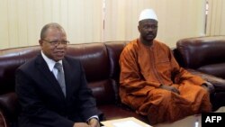 Mali's first post-war prime minister Oumar Tatam Ly (R) takes over on September 6, 2013 from interim Prime Minister Diango Cissoko (L) at a ceremony in Bamako. 