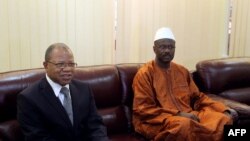 Mali's first post-war prime minister Oumar Tatam Ly (R) took over on September 6, 2013 from former interim Prime Minister Diango Cissoko (L) at a ceremony in Bamako. 