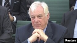 FILE - BBC Trust chairman Chris Patten appears before the Commons Culture, Media and Sport Committee as part of its examination into the BBC's response to the Jimmy Savile disclosures, in London, November 27, 2012. 