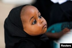 A girl waits her turn at a polio immunization health center in Maiduguri, Borno State, Nigeria, Aug. 29, 2016, after new cases of polio emerged in the state.