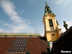 Solar panels are pictured on the roof of the Protestant Reformed Church in Vienna, Austria, April 9, 2013.