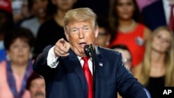 President Donald Trump speaks during a rally, Aug. 4, 2018, in Lewis Center, Ohio. Trump again unleashed a new barrage of attacks on the national news media, saying it was "very dangerous & sick!"