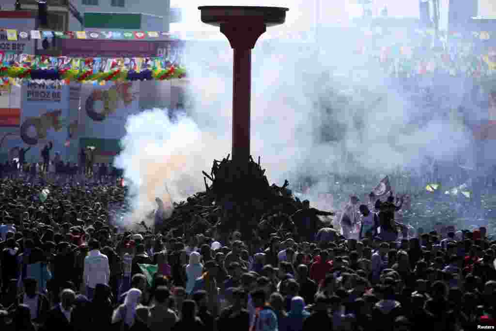 People gather to celebrate Newroz, marking the arrival of spring and the new year, in Diyarbakir, Turkey.