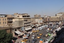In the Iraqi capital, many locals say the country is now protected from Islamic State militants by the Popular Mobilization Forces, a once informal collection of mostly-Shiite fighting groups, now a part of Iraq's state security, in Baghdad, on Oct. 11, 2021.