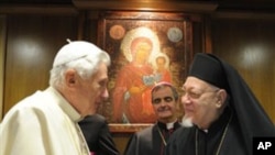 Pope Benedict XVI, left, shakes hands with Coptic Catholic patriarch of Alexandria, Egypt, Antonios Naguib on the last day of the synod of bishops from the Middle East, at the Vatican, 23 Oct 2010